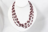 Approx 112 inch strand of 5mm garnet beads and culture rice pearls.