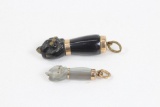 Lot of 2 gold plated fist pendants