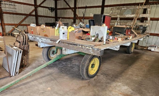 Hayrack on green running gear, 16' x 8'