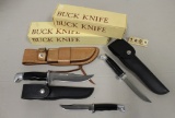 Three Buck Knives in boxes: