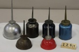 Six Oil Cans