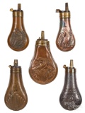 Five embossed copper pistol powder flasks
