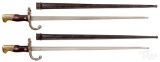 Two French Gras St. Etienne bayonets and scabbards