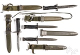 Four US bayonets with scabbards and frogs