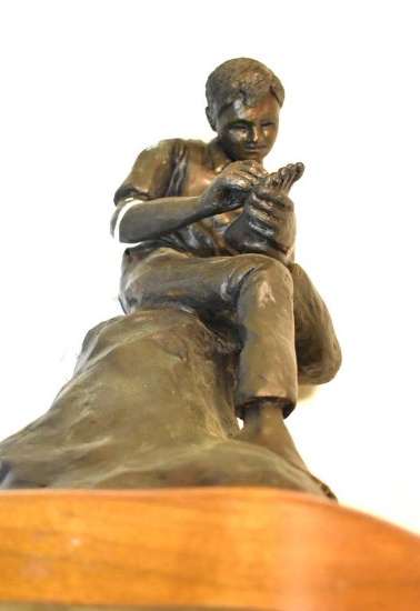 Vintage Bronze Carpenter, seated with sliver in foot, wood base