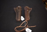 Brown Leather Single Action Holsters, one right and one left handed
