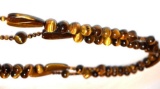 Tiger Eye Carved stone bead necklace, 54 inches around, can loop to make several styles necklace