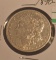 1890-O US Morgan silver dollar, see photos, showing some wear