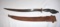 Negrito Bolo, Carved Wood Fist 29 in long with curved blade; Leather Scabbard marked 1969