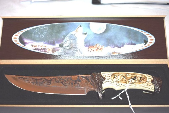 Fantasy Bowie with etched Wolf Scene detailed on blade and Carved Open Handle