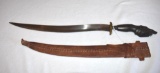 Negrito Bolo, Carved Wood Fist 29 in long with curved blade; Leather Scabbard marked 1969