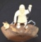 Eskimo Carved Marine Ivory Hunter fishing with catch of fish and canteen, Spear and net underneath,