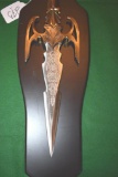 Fantasy Sword/ Dagger Blade Engraved w/some brass trims. stands on display