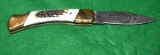 Stag handled Folding Knife with Damascus Blade, Brass bolsters and liner 8 3/4 in as new