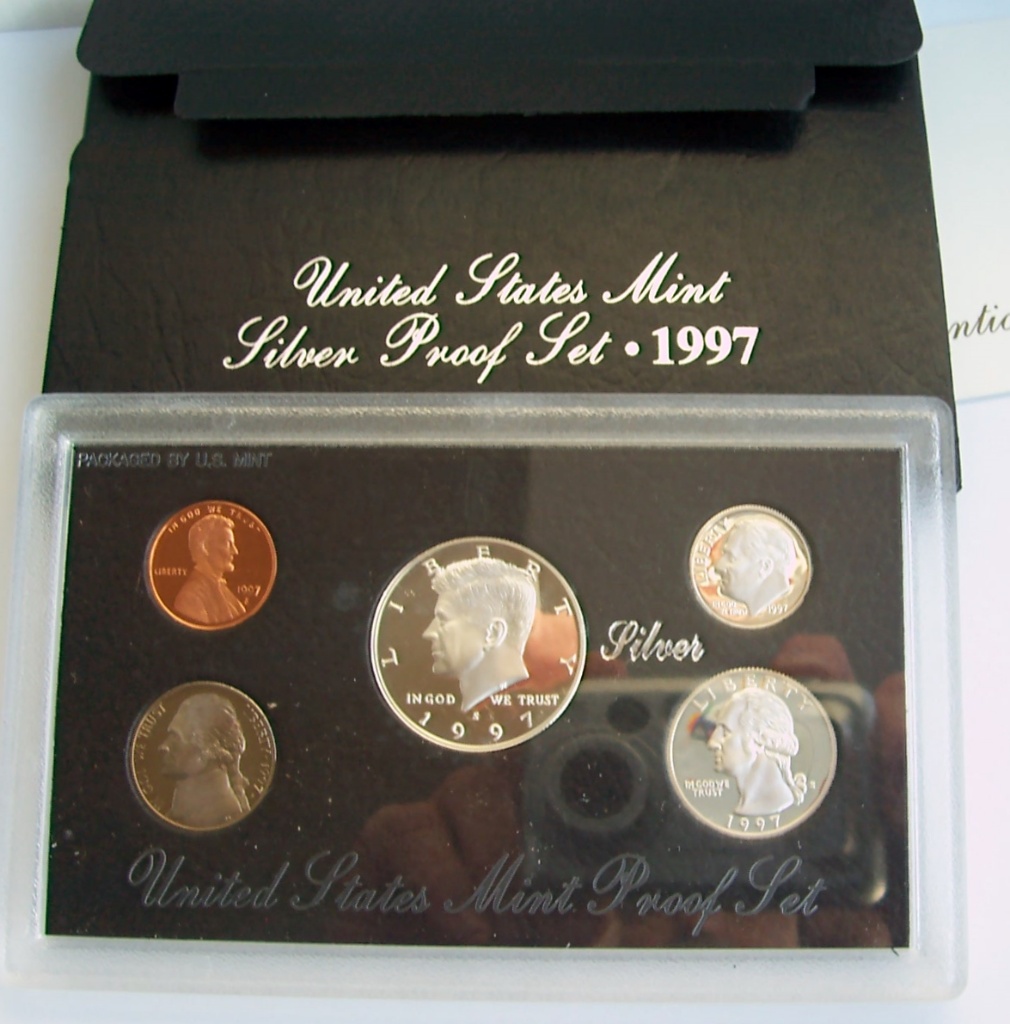 Silver dollars, WL & B Franklin halves,tin signs