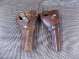 2 leather revolver holsters