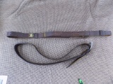 Leather rifle sling and leather belt.