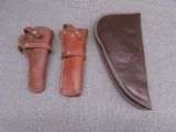 2 leather holsters for revolvers and a pistol case