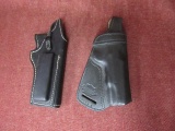 2 leather holsters - nice condition, one has a mag holder