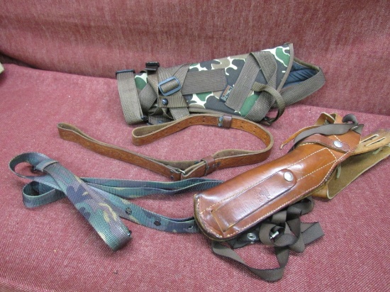 lot of large hunting style revolver holsters and slings