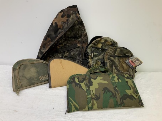 Backpack, 2 small day packs, 3 pistol cases,
