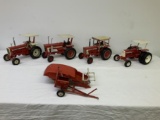 5 die cast toys - 2 Farmall tractors, 1 International tractor,