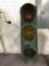 antique stop light painted green
