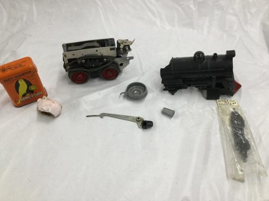 2 small boxes misc. train engine parts