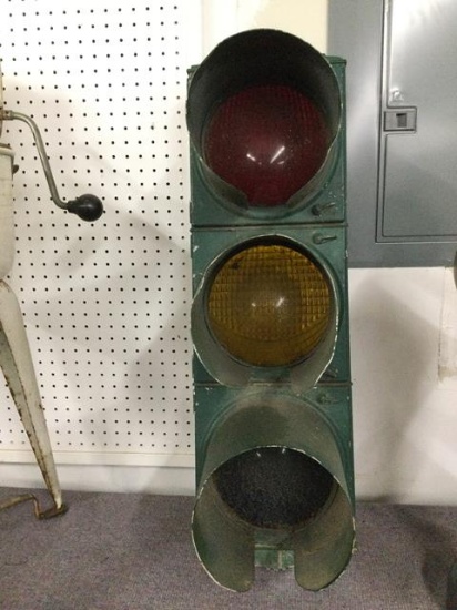antique stop light painted green