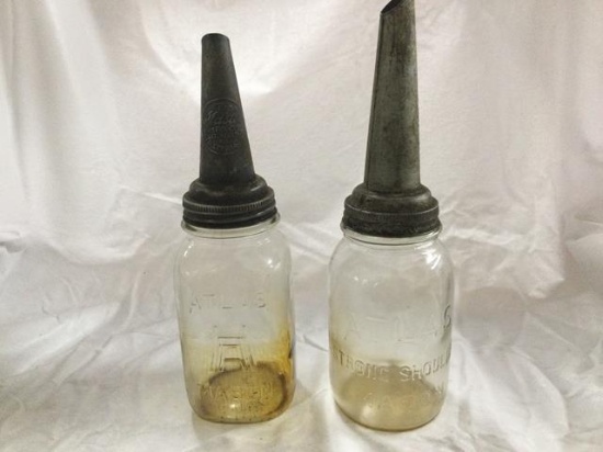 2 vintage master oil spouts on atlass mason jars -both