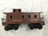 4 lionel train cars - 2 box cars/hopper/caboose