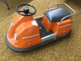 vintage child's coin operated bumper car in pink