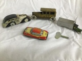 4 small tin litho cars - 1 in garage - all 1 $$