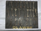 25 antique skeleton keys on board marked dlawrr