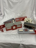 box of O scale plasticville buildings and accessories
