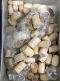 box full of wooden barrels and thread spools