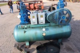 RL Faubion Co. 80-gallon, green dual-pump/motor air compressor.