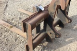 Quick attach forks fit backhoe.