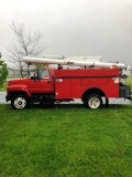 1999 Chevrolet 7500 40' bucket truck with material winch at bucket.