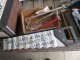 Lot of plumbing tools and sign