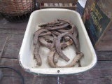 Container of horseshoes