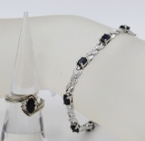 SAPPHIRE COLORED .925 BRACELET AND RING SET. DEEP SAPPHIRE COLORED STONES AND STERLING SILVER BRACEL