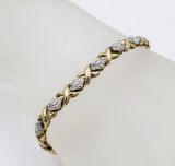 GOLD TONED AND DIAMOND STERLING SILVER BRACELET GOLD TONED AND DIAMONDS TERLINGSILVER BRACELET. 8