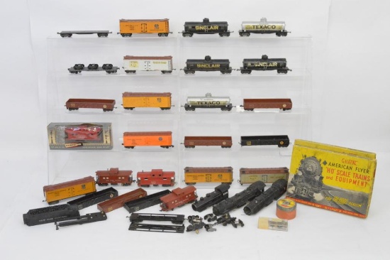 Large group of American Flyer HO die cast freight cars and other parts