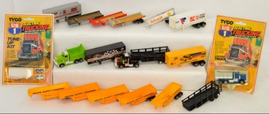 Group of Tyco HO trucking slot car trucks and trailers