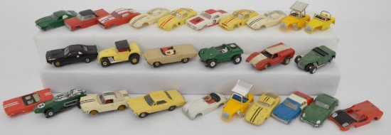 Large group of Aurora HO Model Motoring slot cars and bodies