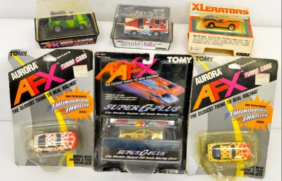 Group of AFX and Aurora slot cars in original boxes
