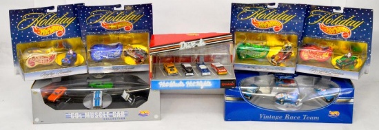 Three Mattel Hot Wheels set packs and Four Holiday Joy rides sets