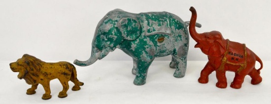 Vintage cast iron / aluminum elephants and lion one is a bank