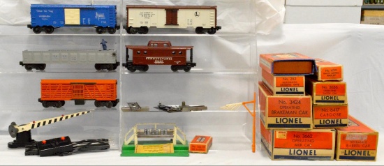 Five Lionel postwar O gauge freight cars in original boxes plus extras